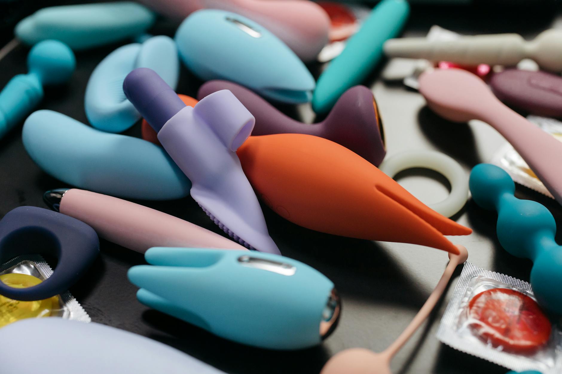 An array of colorful clitoral vibrators displayed together, representing different options for pleasure during menopause.
