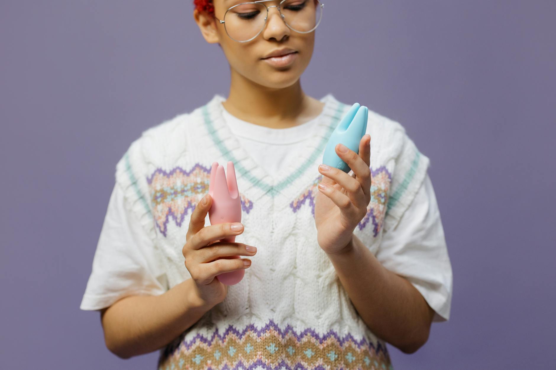 Woman comparing different vibration styles for personal pleasure